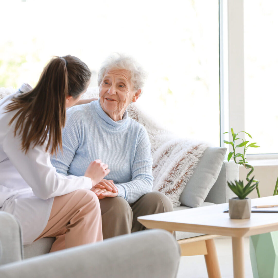 Doctor with senior woman in nursing home